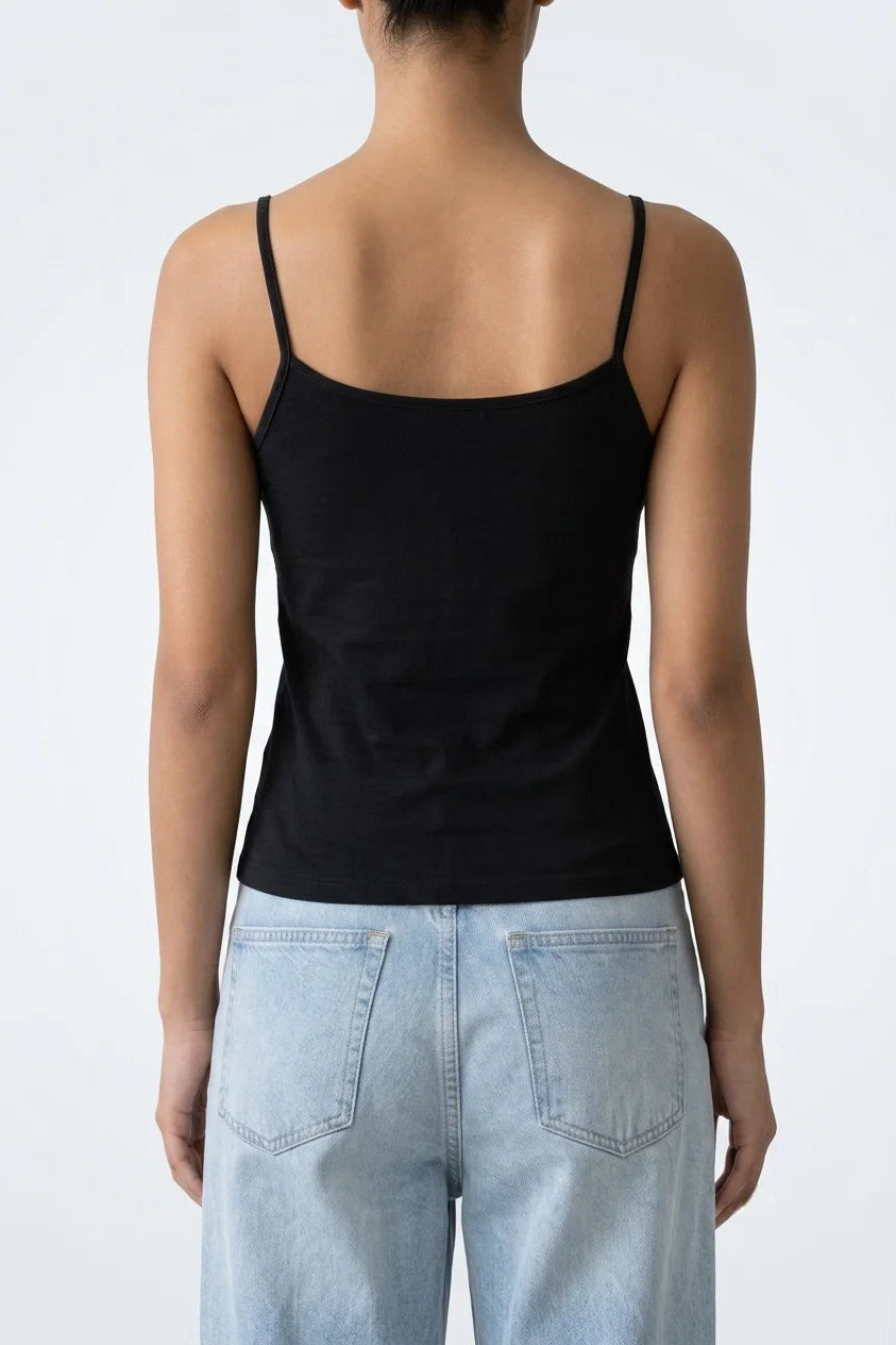 Back view of women's black cotton tank top highlighting scoop back design