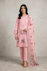 Woman wearing a pink embroidered traditional outfit with a plain background