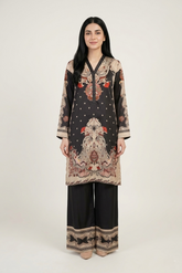 Woman wearing a patterned outfit with a plain background