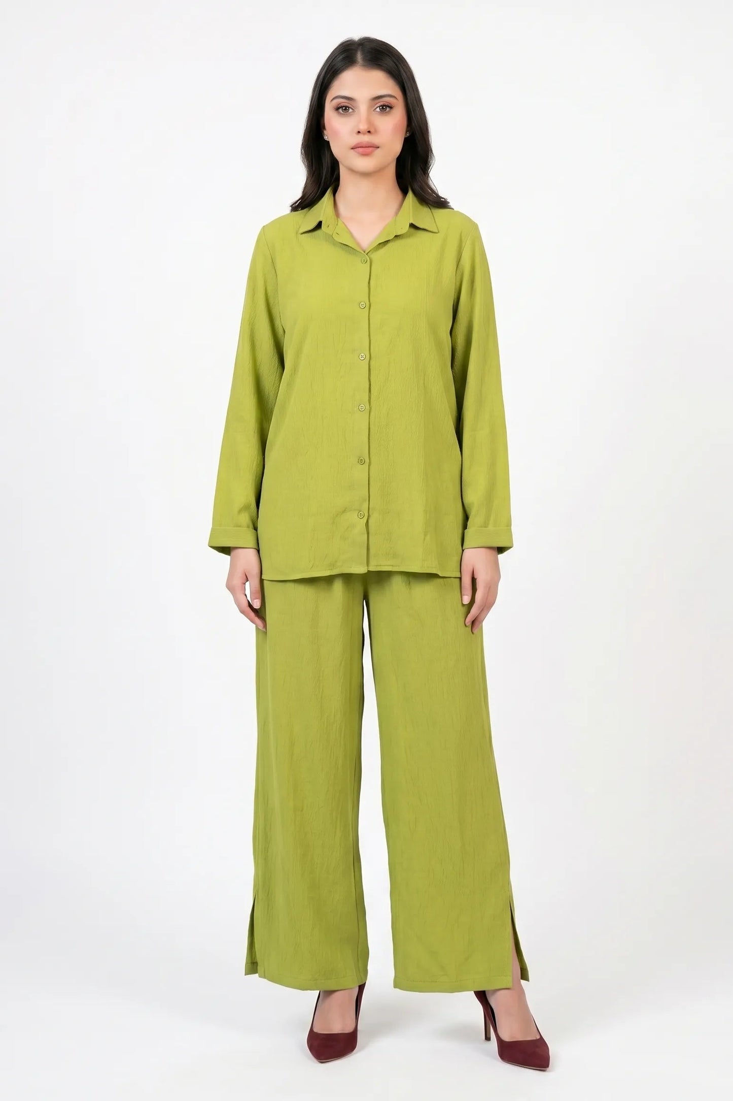 Woman wearing a green outfit on a white background