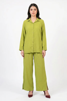 Woman wearing a green outfit on a white background