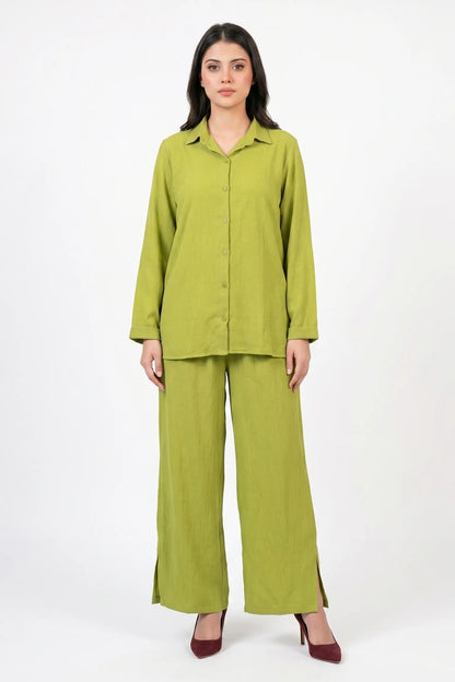 Woman wearing a green outfit on a white background