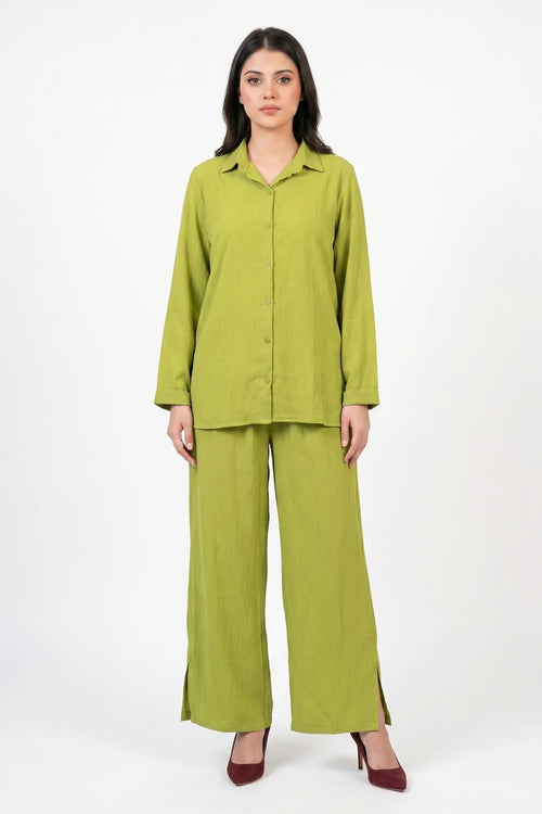 Woman wearing a green outfit on a white background