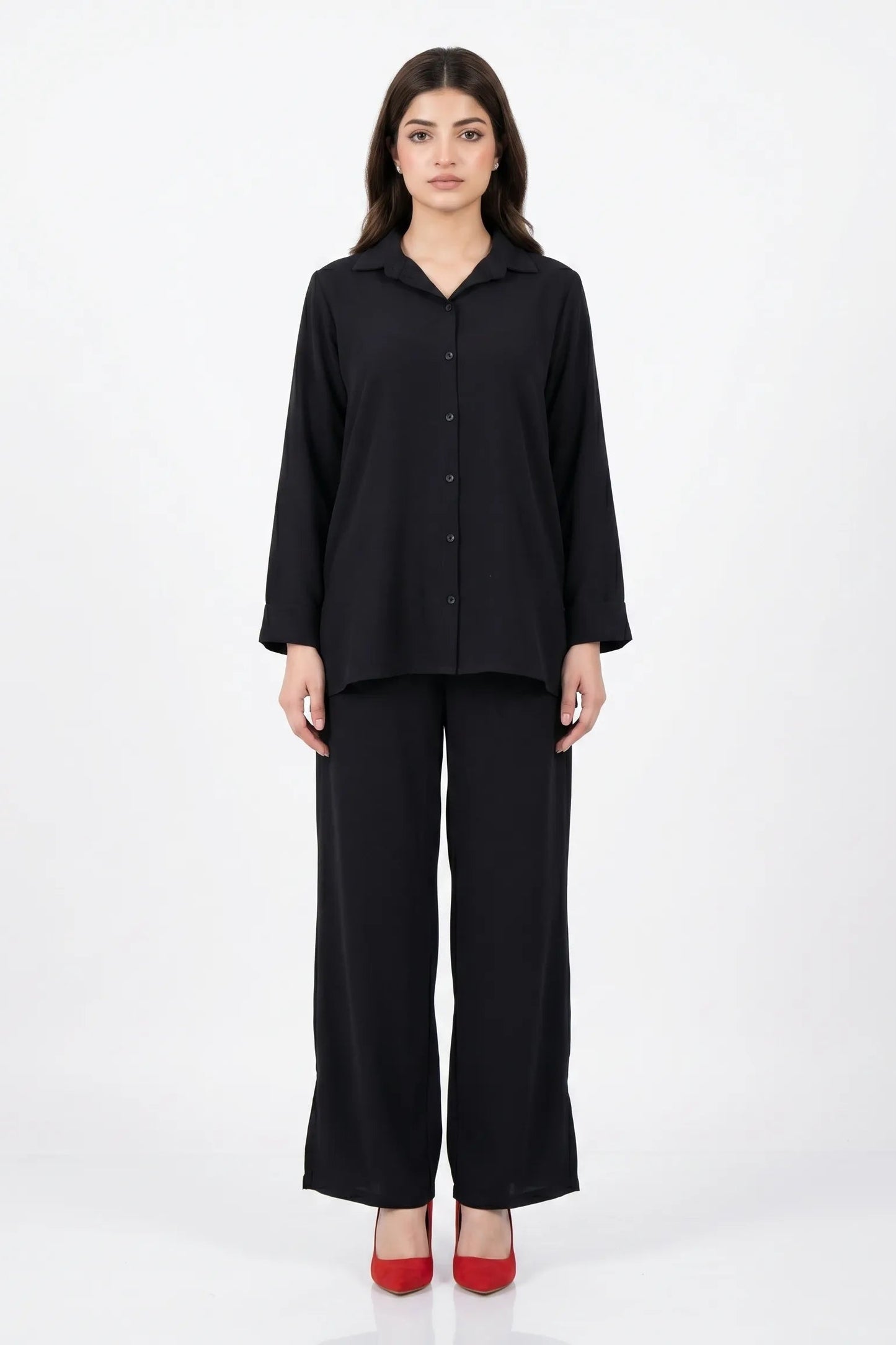 Woman wearing a black outfit on a white background