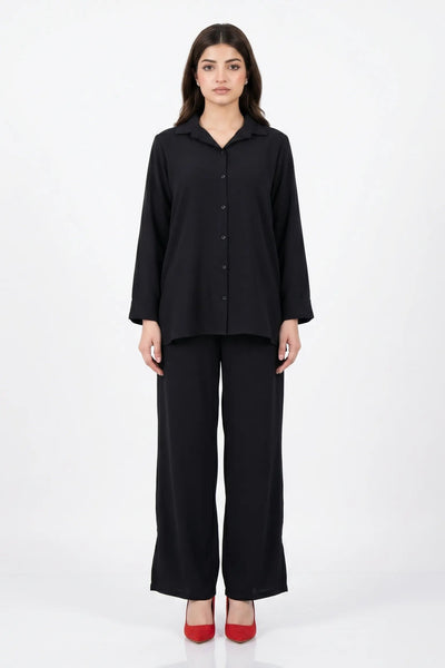 Woman wearing a black outfit on a white background