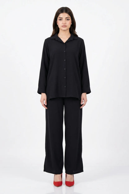 Woman wearing a black outfit on a white background