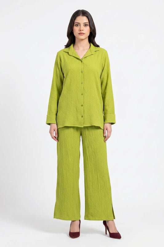 Woman wearing a green outfit on a white background