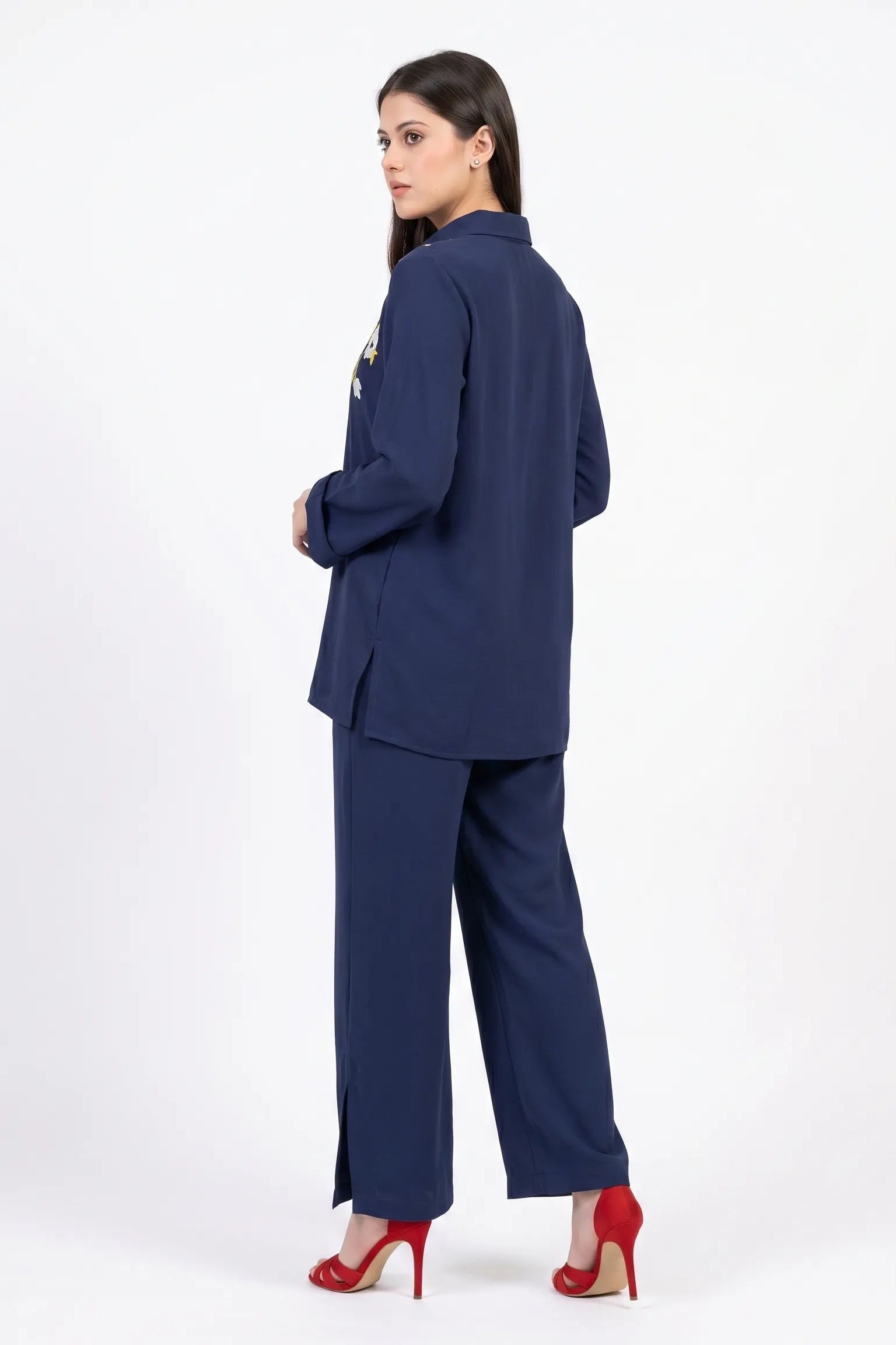 Woman wearing a navy blue suit on a white background