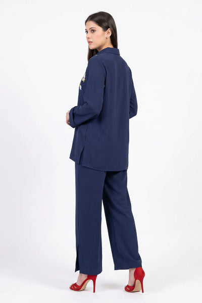Woman wearing a navy blue suit on a white background