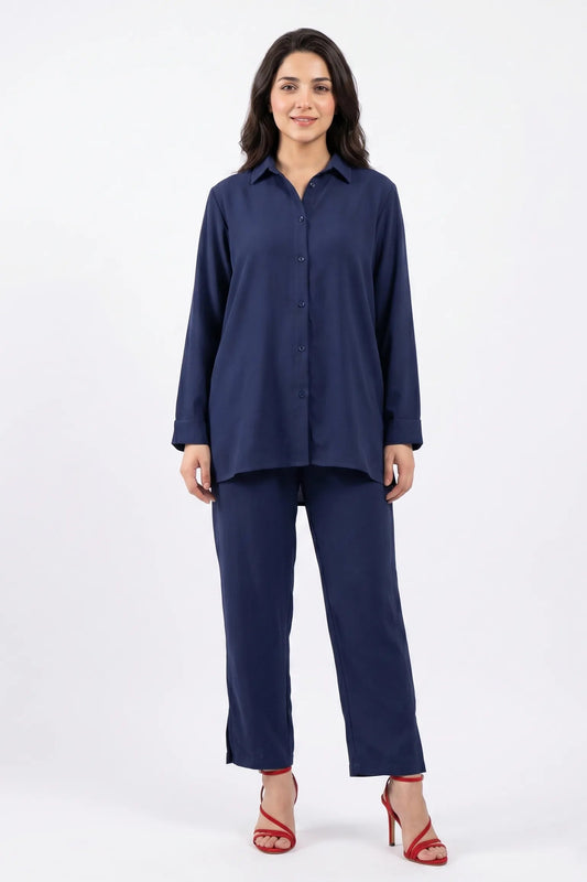 Woman wearing a navy blue outfit on a white background