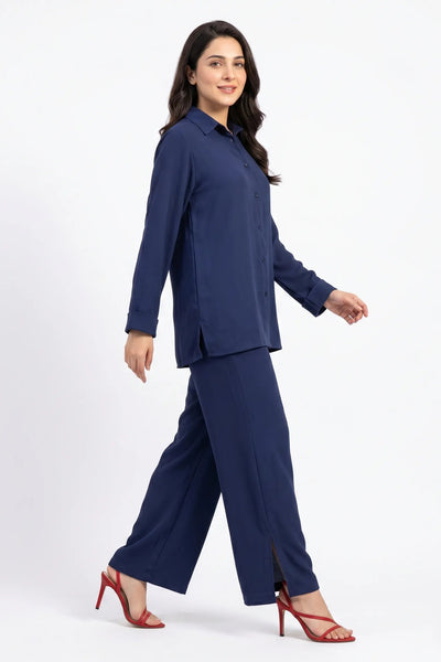 Woman wearing a navy blue suit on a white background