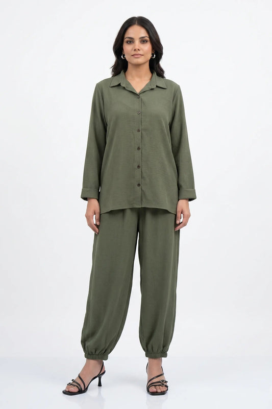 Woman wearing a green outfit on a white background