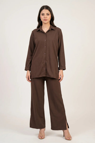 Woman wearing a brown outfit on a white background