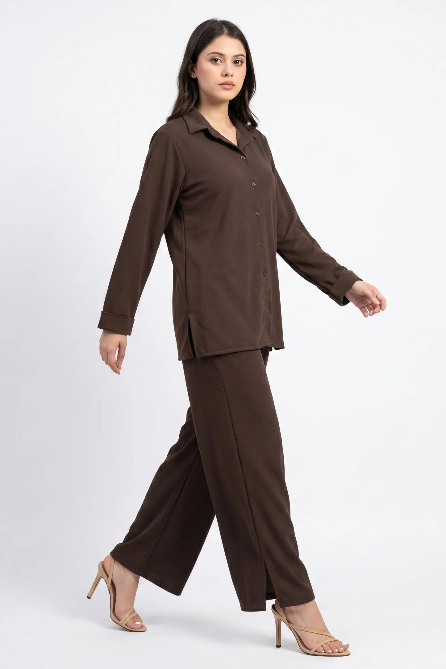 Woman wearing a brown suit on a white background