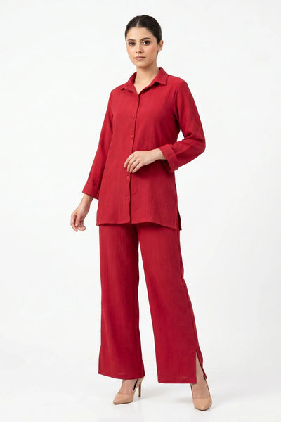 Woman wearing a red outfit on a white background