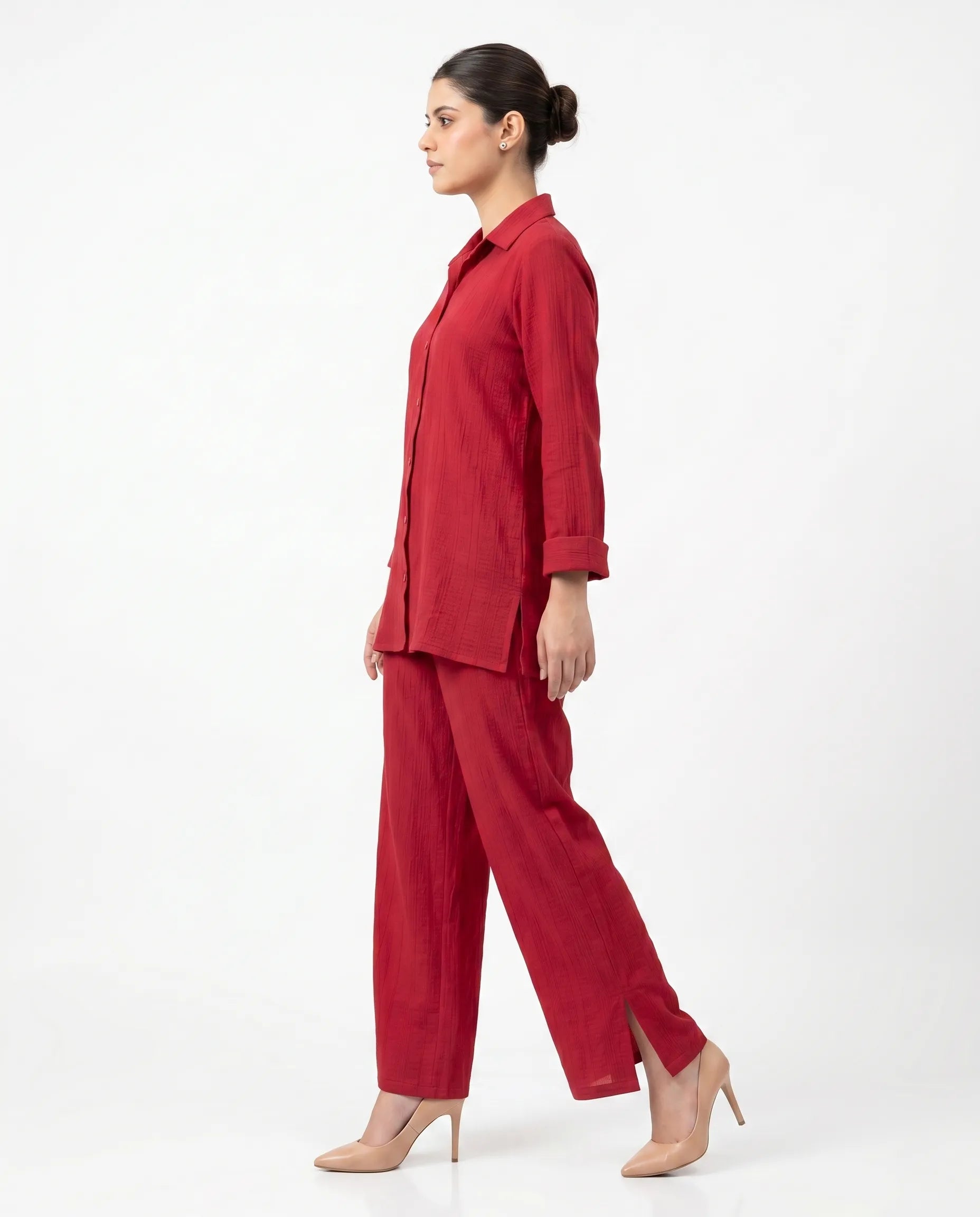 Woman wearing a red outfit on a white background