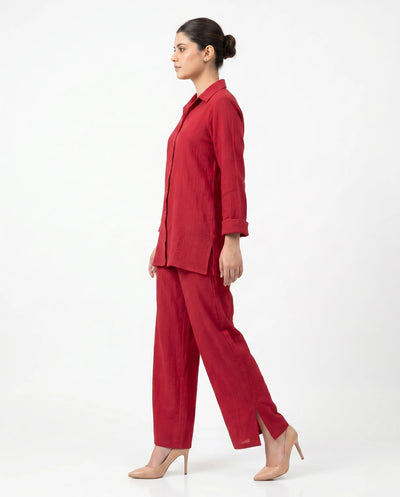 Woman wearing a red outfit on a white background