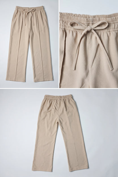 Three-panel product photo of beige drawstring pants shown flat against a light gray background, including a full-length view, a close-up of the waistband and tie, and another full-length view.