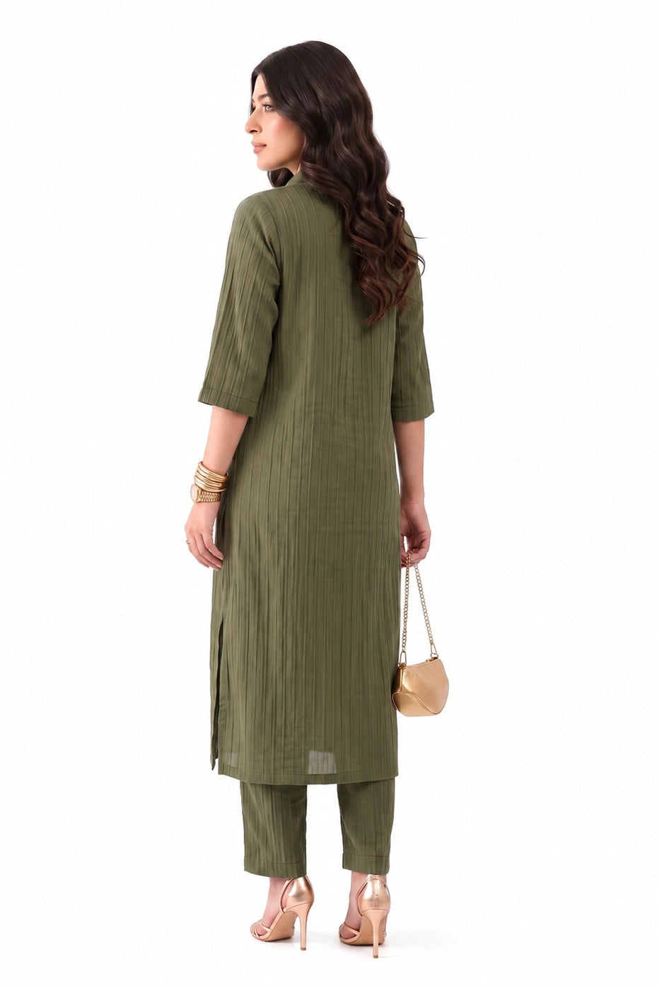 A woman shown from the back wearing an olive green three-piece kurta set with three-quarter sleeves and matching pants, holding a small beige handbag against a plain white background.
